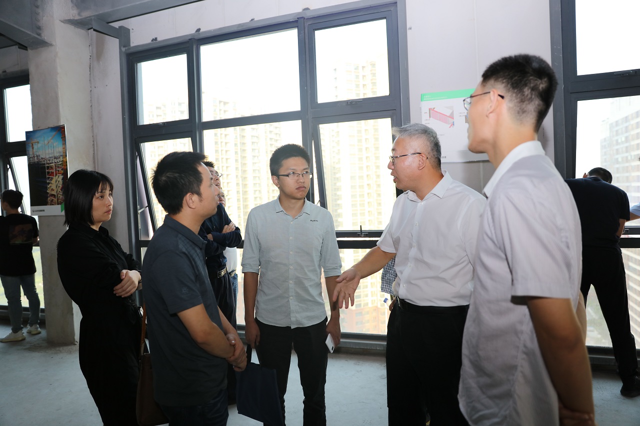 Yantian housing authority's 2019 prefabrication and construction-waste training visits Cumark Tower — original report image 3